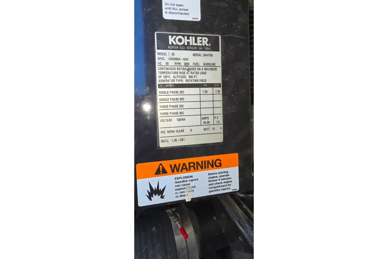 Slide: The Image of Kohler generator label with specifications and warning on a 2006 Carver 36 Mariner. - 46