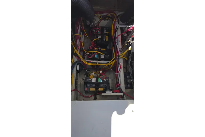 Slide: The Image of Electrical wiring and batteries inside a 2006 Carver 36 Mariner boat. - 47