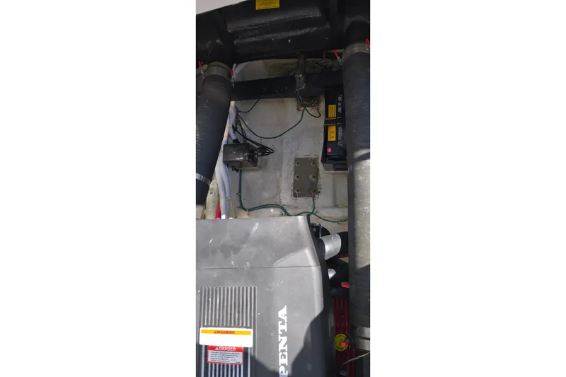 Slide: The Image of Engine compartment of a 2006 Carver 36 Mariner with visible Volvo Penta components. - 49