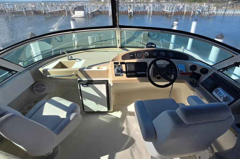 Slide: The Image of Helm of 2006 Carver 36 Mariner yacht with steering wheel and navigation equipment. - 6