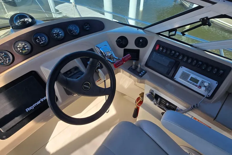 Slide: The Image of Helm of 2006 Carver 36 Mariner with steering wheel, gauges, and navigation equipment. - 7