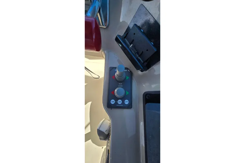 Slide: The Image of Control panel of a 2006 Carver 36 Mariner boat with joystick and buttons. - 8