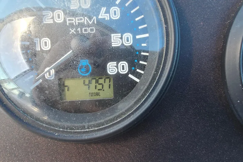 Slide: The Image of Close-up of a 2006 Carver 36 Mariner RPM gauge displaying 4757 hours. - 9