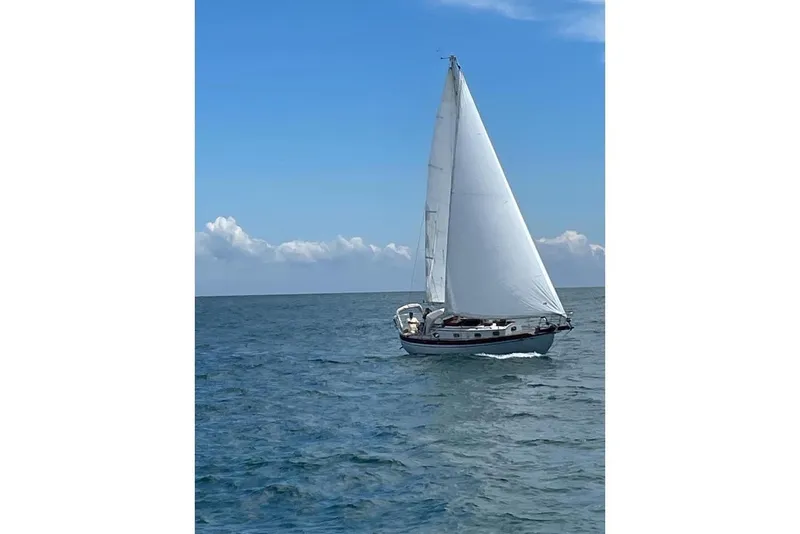 Slide: The Image of Sailboat on open sea, Baba 30 model from 1979, under clear blue sky. - 5