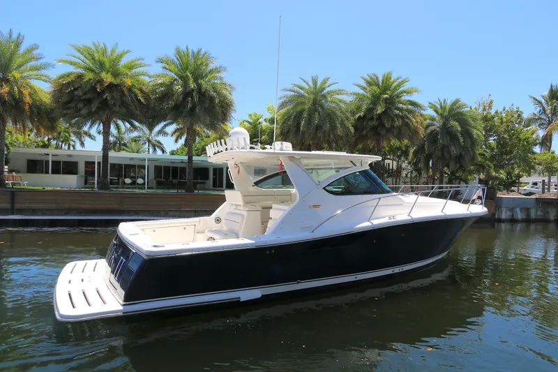 The Image of 2005 Tiara Yachts 3800 Open docked near palm trees on a sunny day. - 0