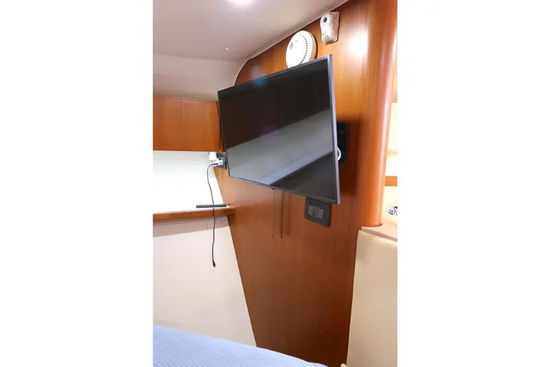 Slide: The Image of Flat-screen TV mounted in 2005 Tiara Yachts 3800 Open cabin interior. - 4
