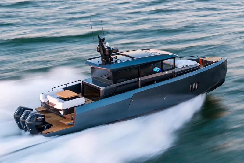 The Image of 2026 XO EXPLR 44 yacht speeding on water, showcasing sleek design and powerful engines. - 1