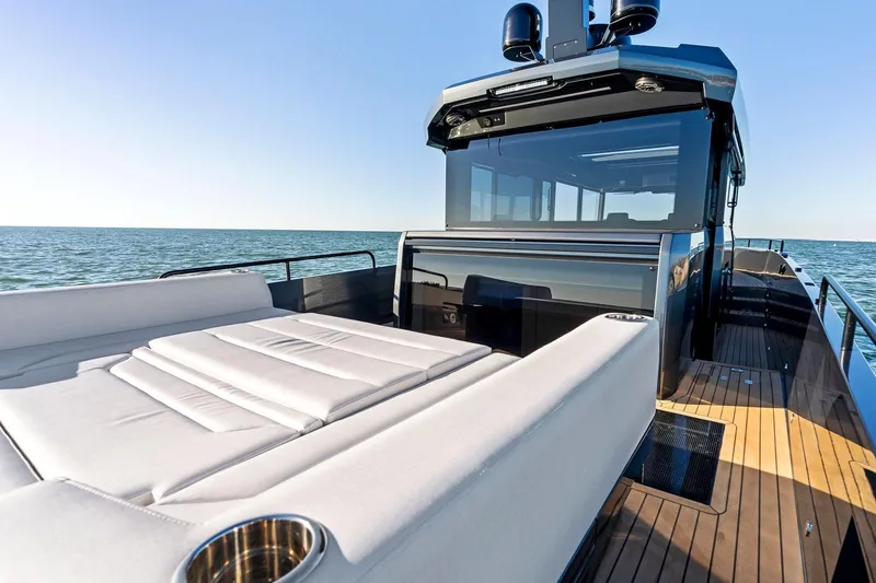 Slide: The Image of Luxury XO EXPLR 44 yacht, 2026 model, featuring sleek design and spacious deck on open water. - 11