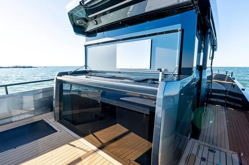 Slide: The Image of Modern XO EXPLR 44 yacht deck with sleek design, 2026 model, overlooking the ocean. - 12