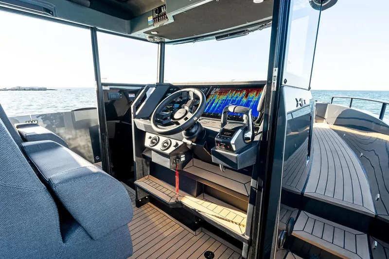 Slide: The Image of Modern cockpit of 2026 XO EXPLR 44 boat with advanced navigation systems. - 14