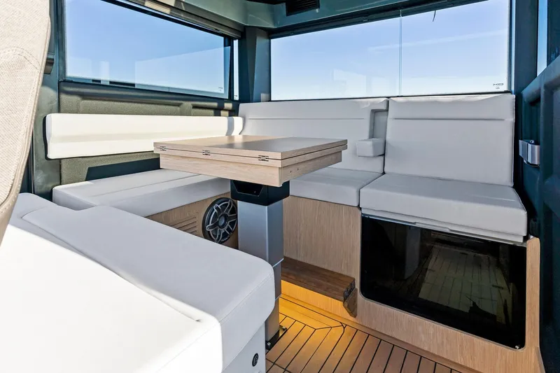 Slide: The Image of Interior of 2026 XO EXPLR 44 yacht with modern seating and table. - 17