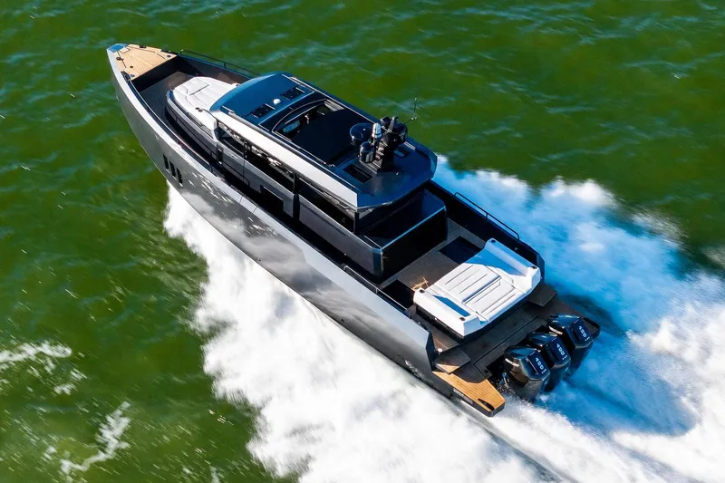 Slide: The Image of 2026 XO EXPLR 44 yacht cruising swiftly on open water. - 2