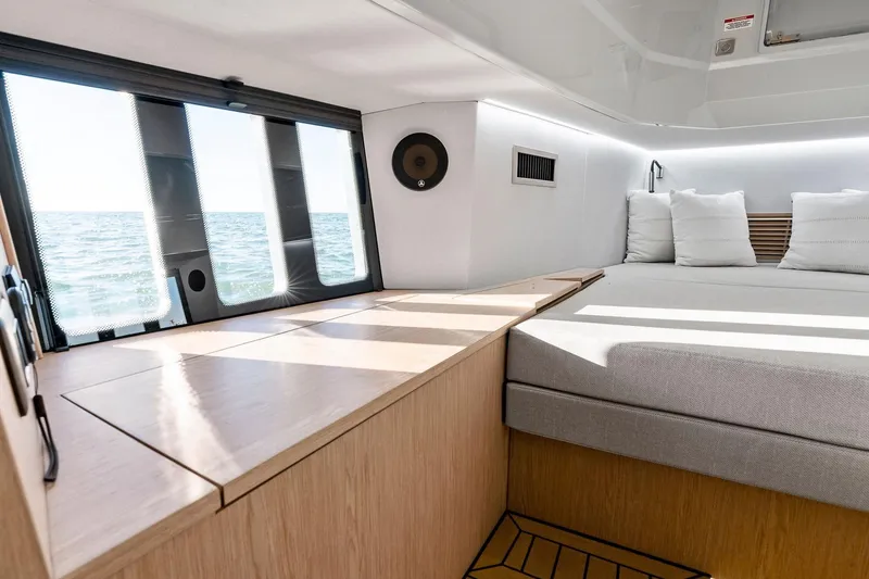 Slide: The Image of Modern interior of 2026 XO EXPLR 44 yacht with ocean view through large windows. - 20