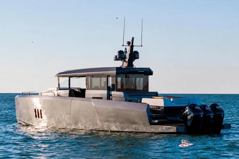 Slide: The Image of 2026 XO EXPLR 44 yacht on calm sea with clear sky. - 3