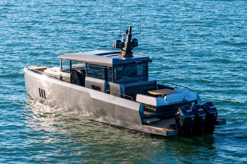 Slide: The Image of Modern XO EXPLR 44 yacht cruising on open water, 2026 model. - 4
