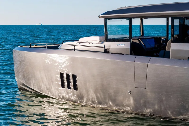Slide: The Image of Modern XO EXPLR 44 yacht cruising on open sea, 2026 model. - 6
