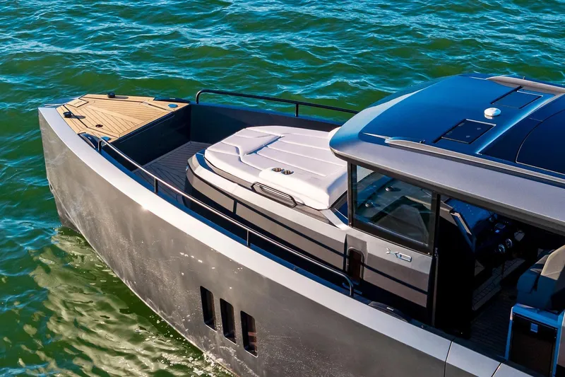 Slide: The Image of 2026 XO EXPLR 44 luxury yacht cruising on blue water. - 8
