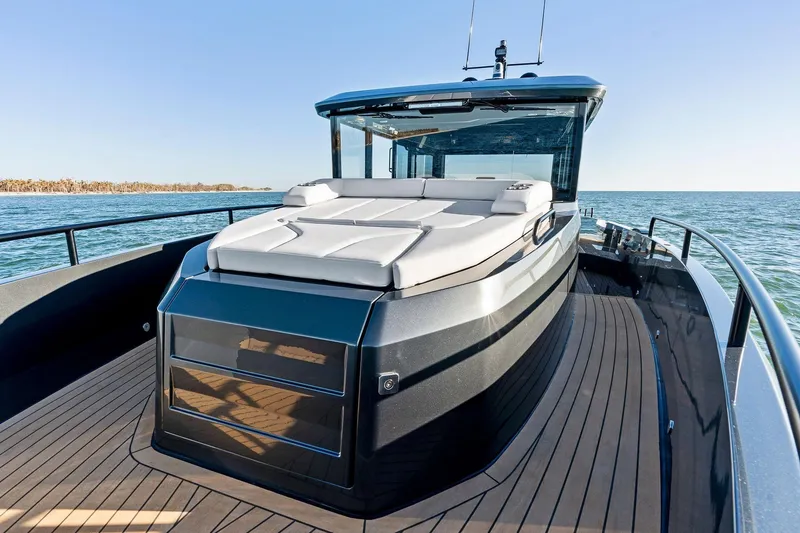 Slide: The Image of 2026 XO EXPLR 44 yacht with sleek design and spacious deck on open water. - 9