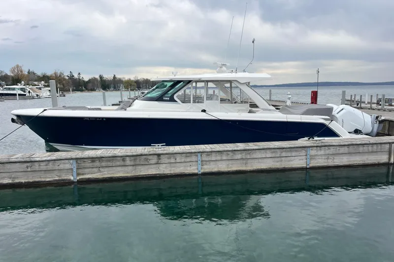 The Image of 2023 Tiara Yachts 43 LS docked at a marina, showcasing sleek design and luxury features. - 0