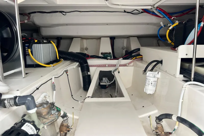 Slide: The Image of Engine compartment of 2023 Tiara Yachts 43 LS, showcasing wiring and mechanical components. - 15