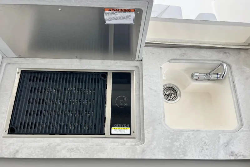 Slide: The Image of Outdoor kitchen on 2023 Tiara Yachts 43 LS with grill and sink. - 20