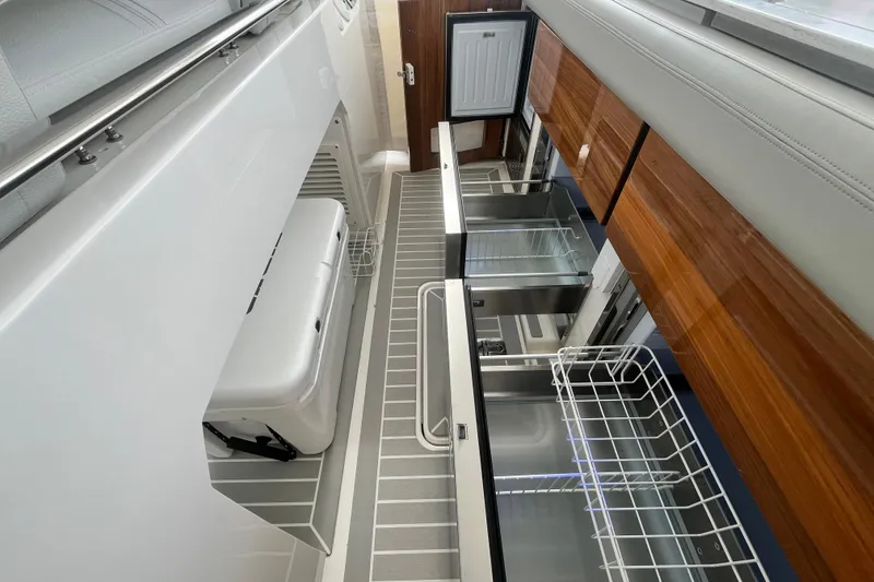 Slide: The Image of Interior of 2023 Tiara Yachts 43 LS featuring sleek storage and modern design elements. - 21