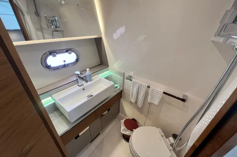 Slide: The Image of Luxurious bathroom in 2023 Tiara Yachts 43 LS, featuring modern sink and elegant fixtures. - 26