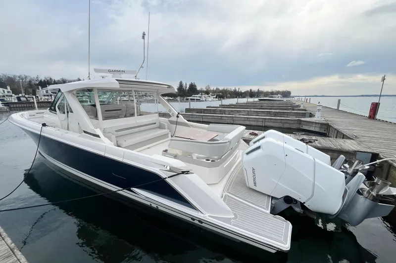 Slide: The Image of 2023 Tiara Yachts 43 LS docked, showcasing sleek design and powerful Mercury engines. - 3
