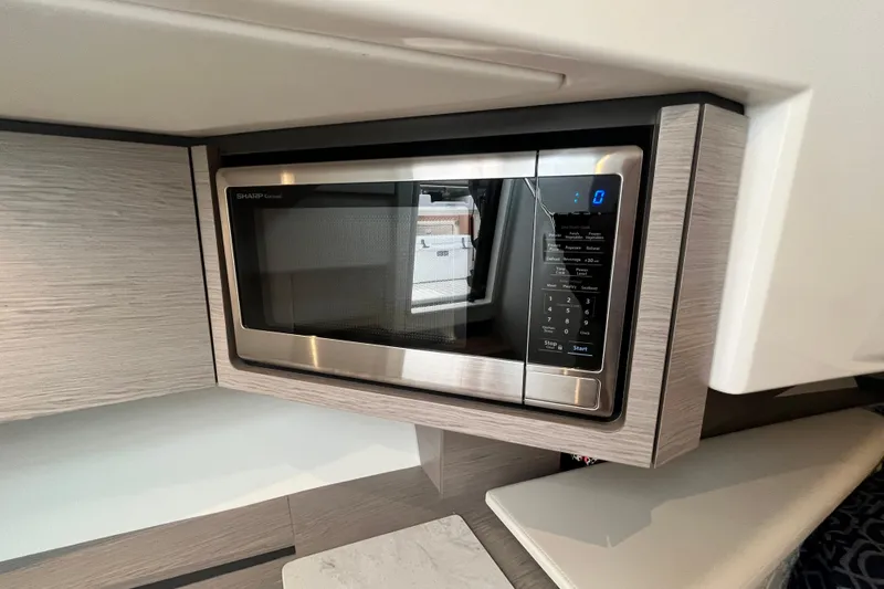 Slide: The Image of Modern microwave in 2023 Tiara Yachts 43 LS kitchen area. - 31