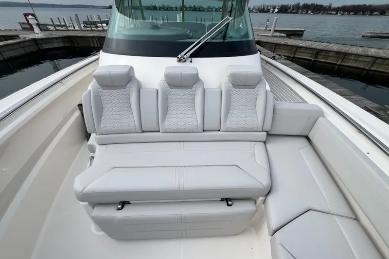 Slide: The Image of 2023 Tiara Yachts 43 LS luxury seating, docked at a marina. - 33