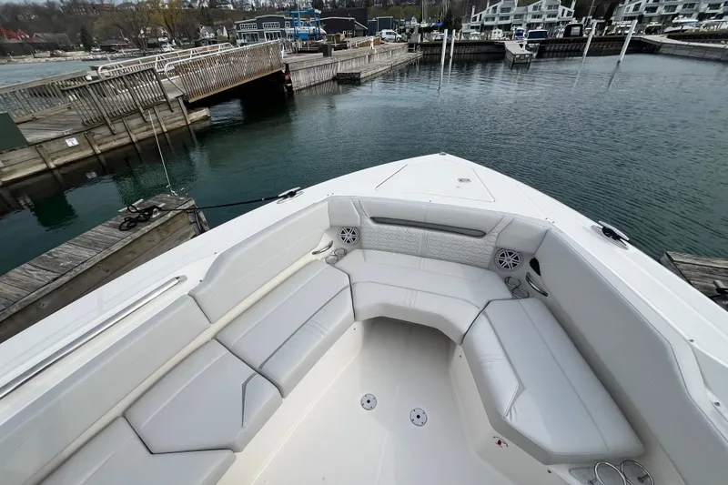 Slide: The Image of 2023 Tiara Yachts 43 LS boat interior with white seating at dock. - 35