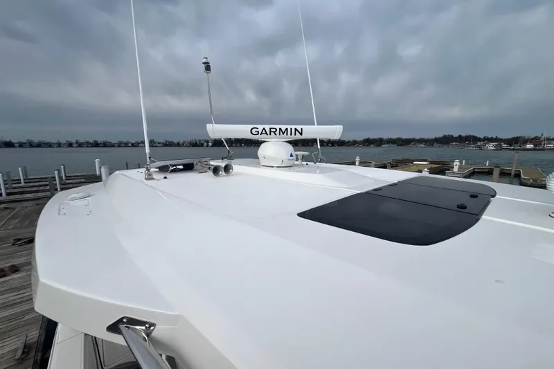 Slide: The Image of 2023 Tiara Yachts 43 LS with Garmin radar, docked by the waterfront. - 39