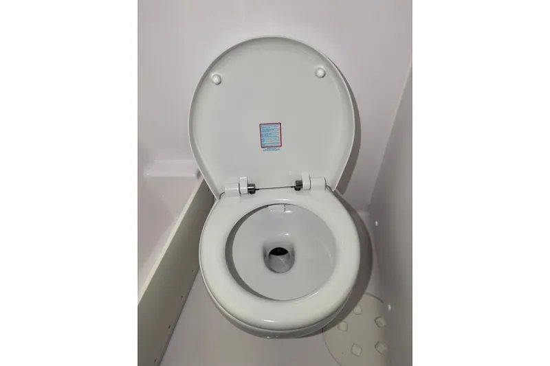 Slide: The Image of Modern white toilet in XO EXPLR 9, 2026 model, showcasing sleek design. - 13