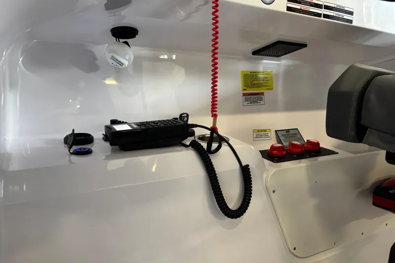 Slide: The Image of Control panel of 2026 XO EXPLR 9 boat with communication device and safety features. - 22