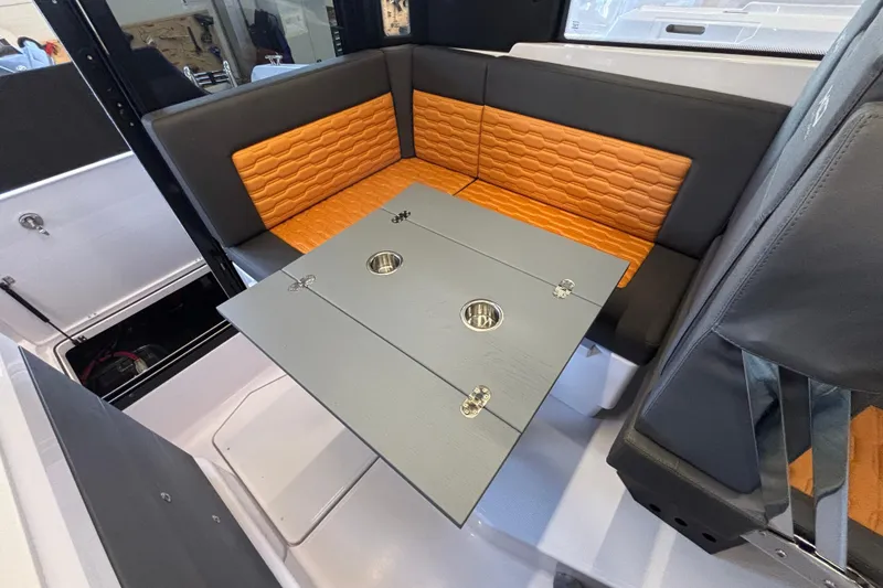 Slide: The Image of Interior of 2026 XO EXPLR 9 boat with stylish seating and foldable table. - 29