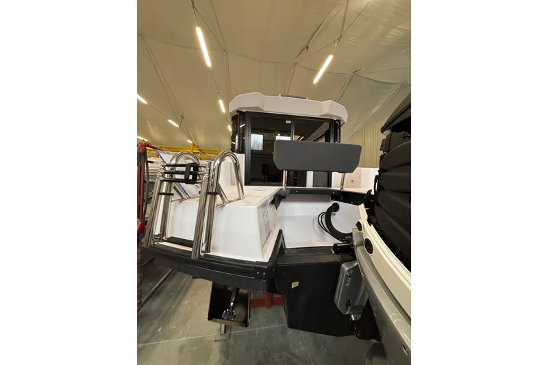 Slide: The Image of 2026 XO EXPLR 9 boat interior with modern design and stainless steel features. - 7