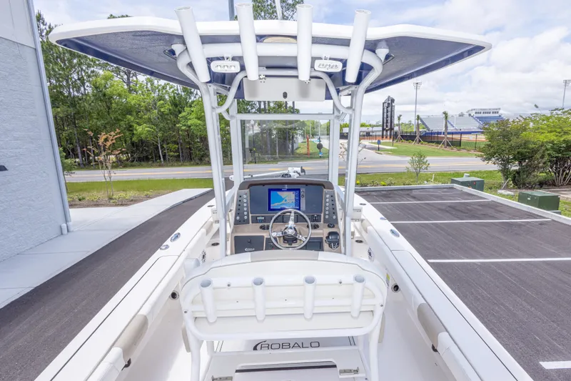Slide: The Image of 2024 Robalo 246 Cayman boat interior with advanced navigation system and seating. - 13