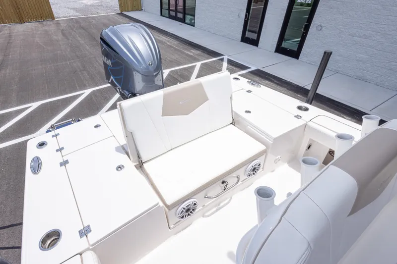 Slide: The Image of 2024 Robalo 246 Cayman boat interior with seating and Yamaha outboard motor. - 14