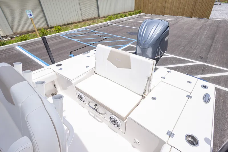 Slide: The Image of 2024 Robalo 246 Cayman boat with Yamaha engine in parking lot. - 15