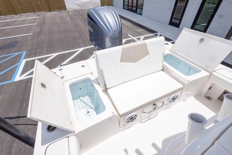 Slide: The Image of 2024 Robalo 246 Cayman boat interior with seating and storage compartments. - 17