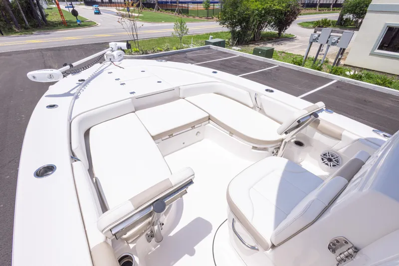 Slide: The Image of 2024 Robalo 246 Cayman boat interior with seating and steering console. - 29