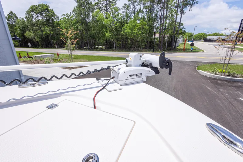 Slide: The Image of 2024 Robalo 246 Cayman boat with Minn Kota Terrova trolling motor on deck. - 31
