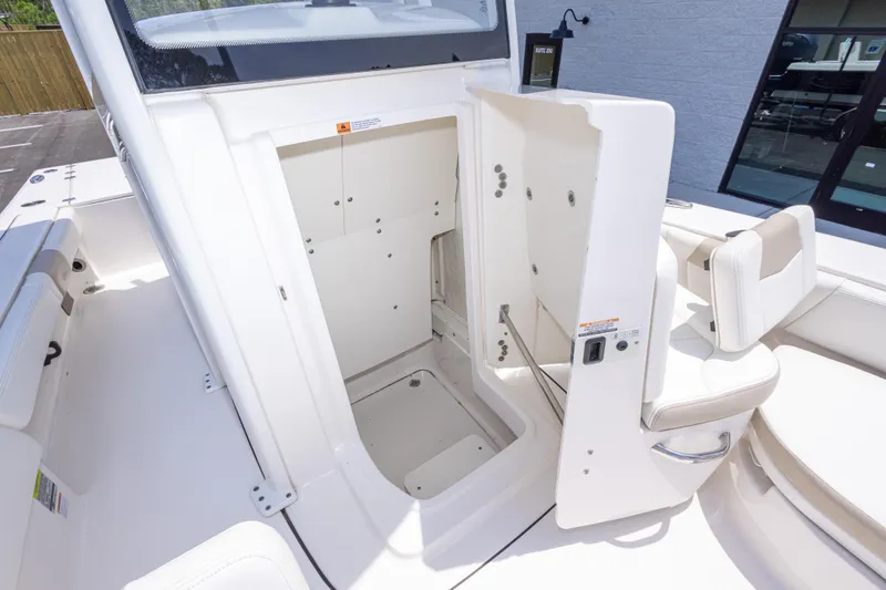 Slide: The Image of 2024 Robalo 246 Cayman boat interior with open storage compartment. - 35