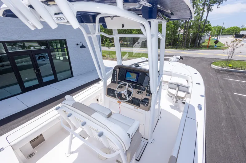 Slide: The Image of 2024 Robalo 246 Cayman boat interior with modern helm and seating. - 41