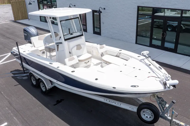 Slide: The Image of 2024 Robalo 246 Cayman boat on trailer, parked outside a building. - 43