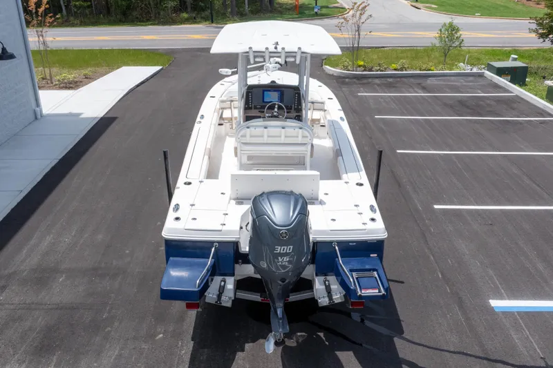 Slide: The Image of 2024 Robalo 246 Cayman boat with Yamaha 300 V6 engine in parking lot. - 46