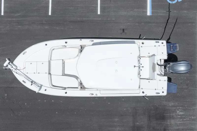 Slide: The Image of Top view of 2024 Robalo 246 Cayman boat in a parking lot. - 52