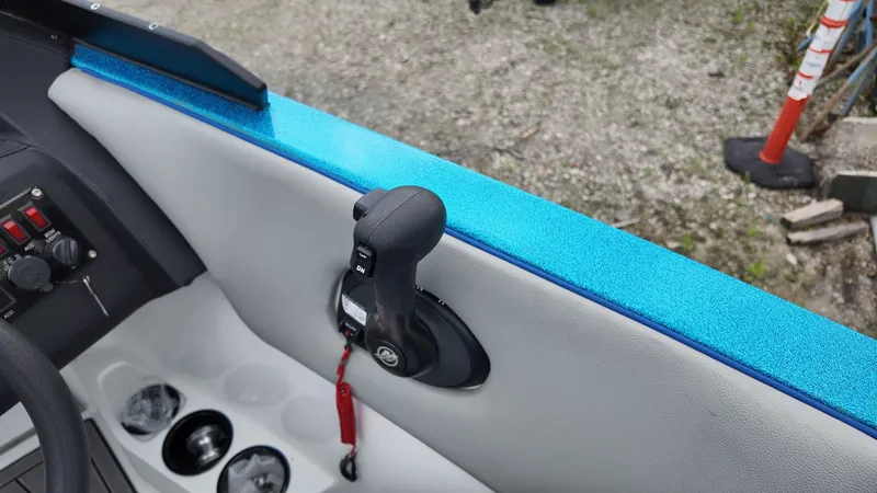 Slide: The Image of Interior view of a 2025 Flightcraft Boat with blue trim. - 14