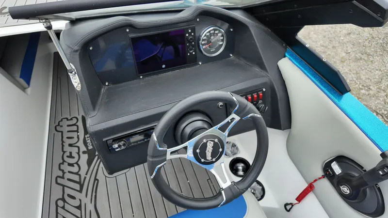 Slide: The Image of 2025 Flightcraft Boats cockpit with steering wheel and dashboard. - 15