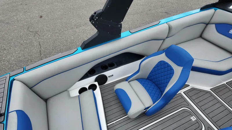 Slide: The Image of Interior of a 2025 Flightcraft Boat with blue and gray seating. - 17